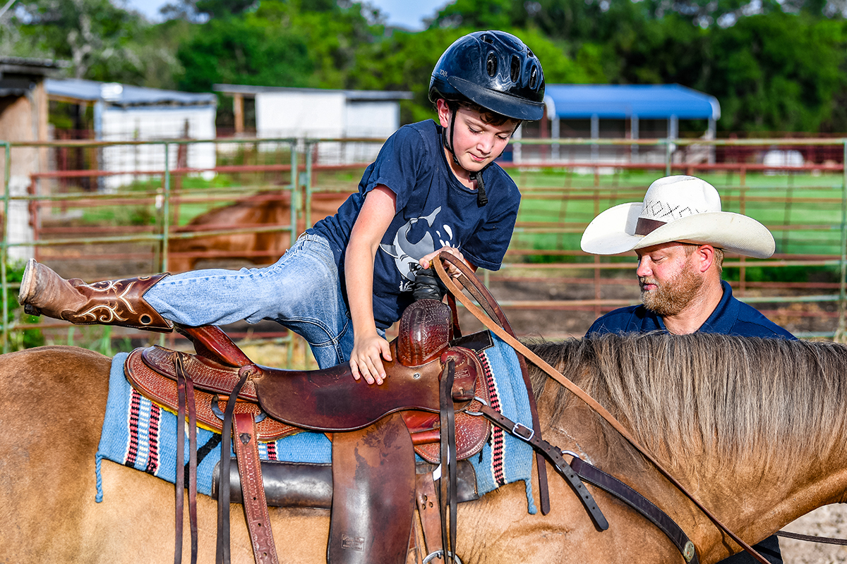 Boy Mounts Horse